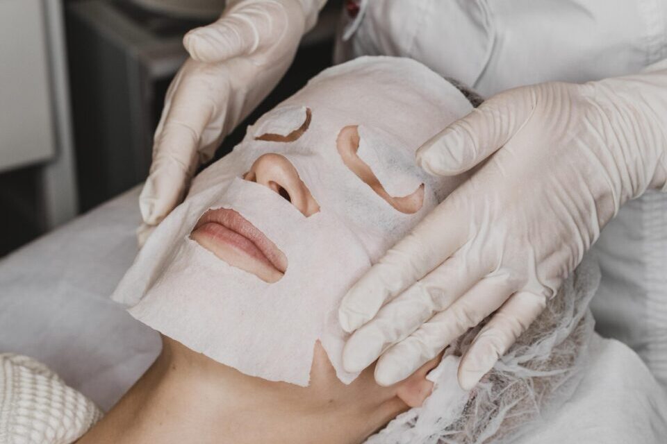 woman-getting-skin-mask-treatment